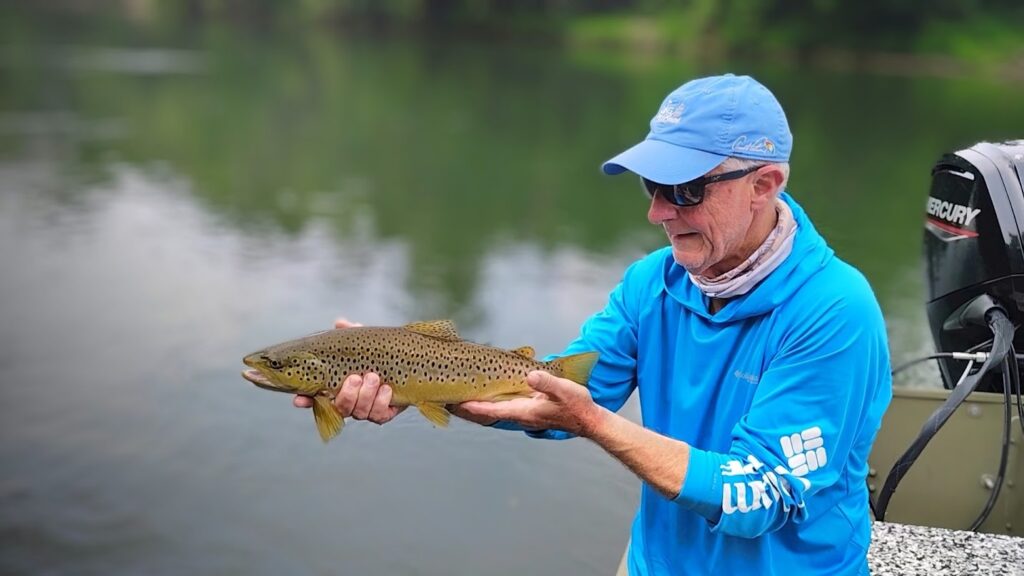 A client holding a beautiful Brown Trout caught on a guided boat trip on the Cumberland River.