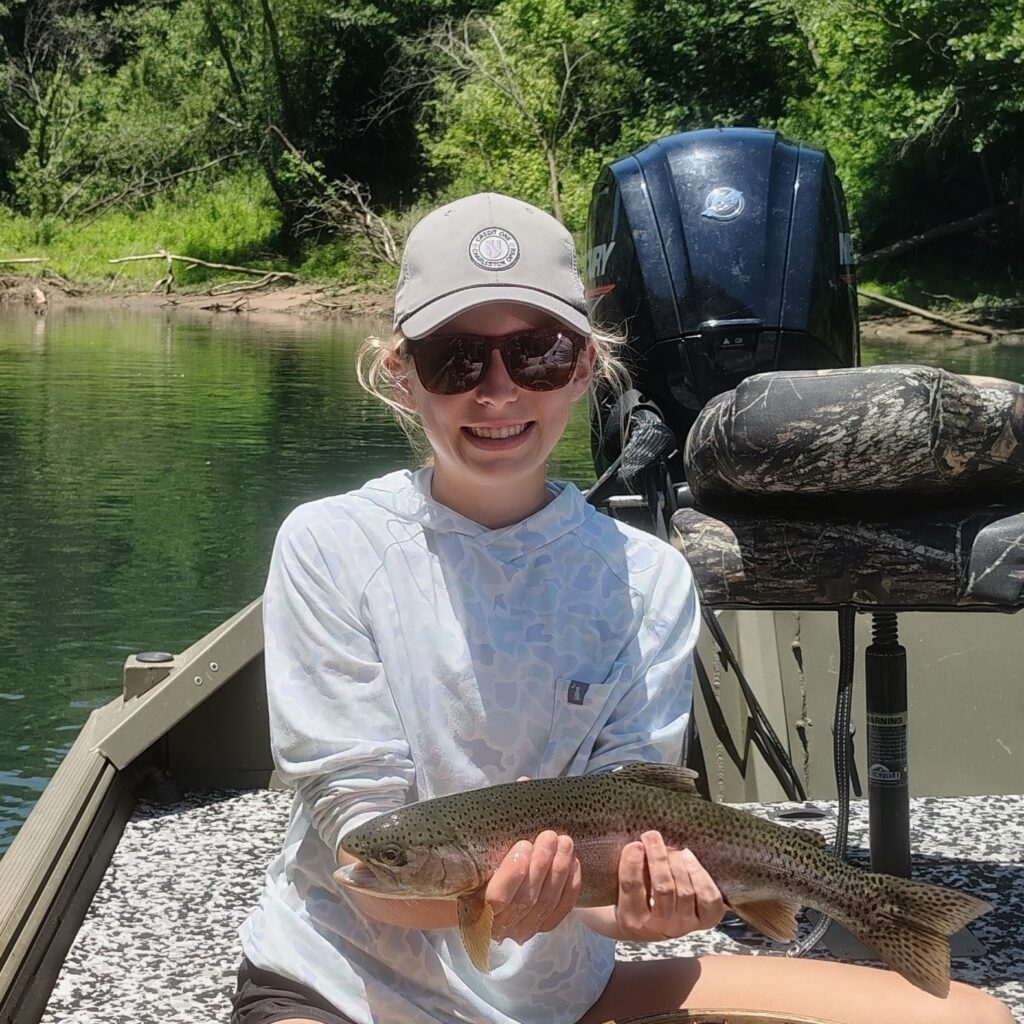 Young Lady catching Rainbow Trout on the Cumberland River.