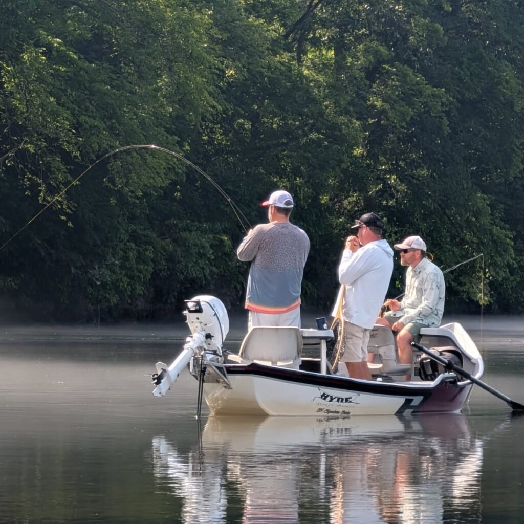 A great customer fighting a big Rainbow Trout on the Holston River