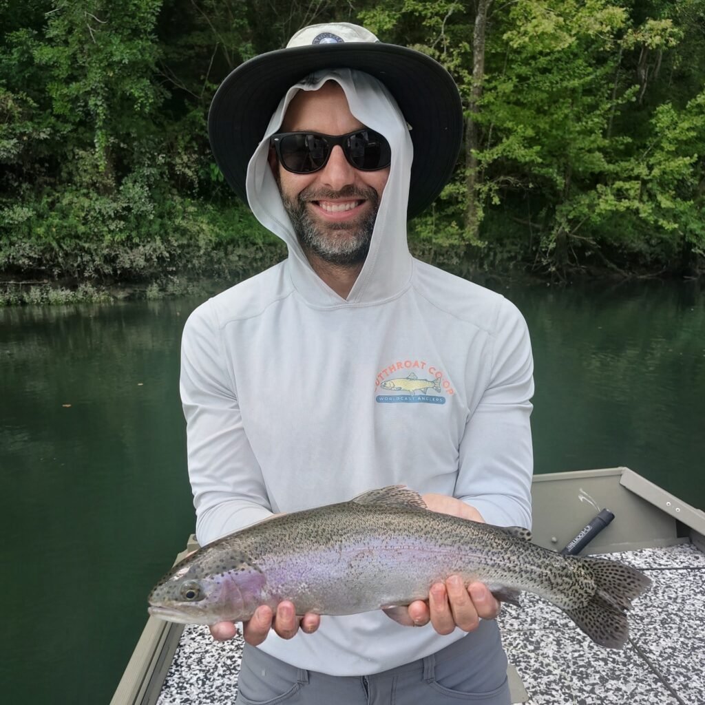 A man holding a Rainbow Trout
